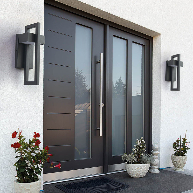 Aluminum alloy sand black rectangular Osram LED outdoor wall sconce at three-quarter angle showing matte black finish and acrylic lampshade