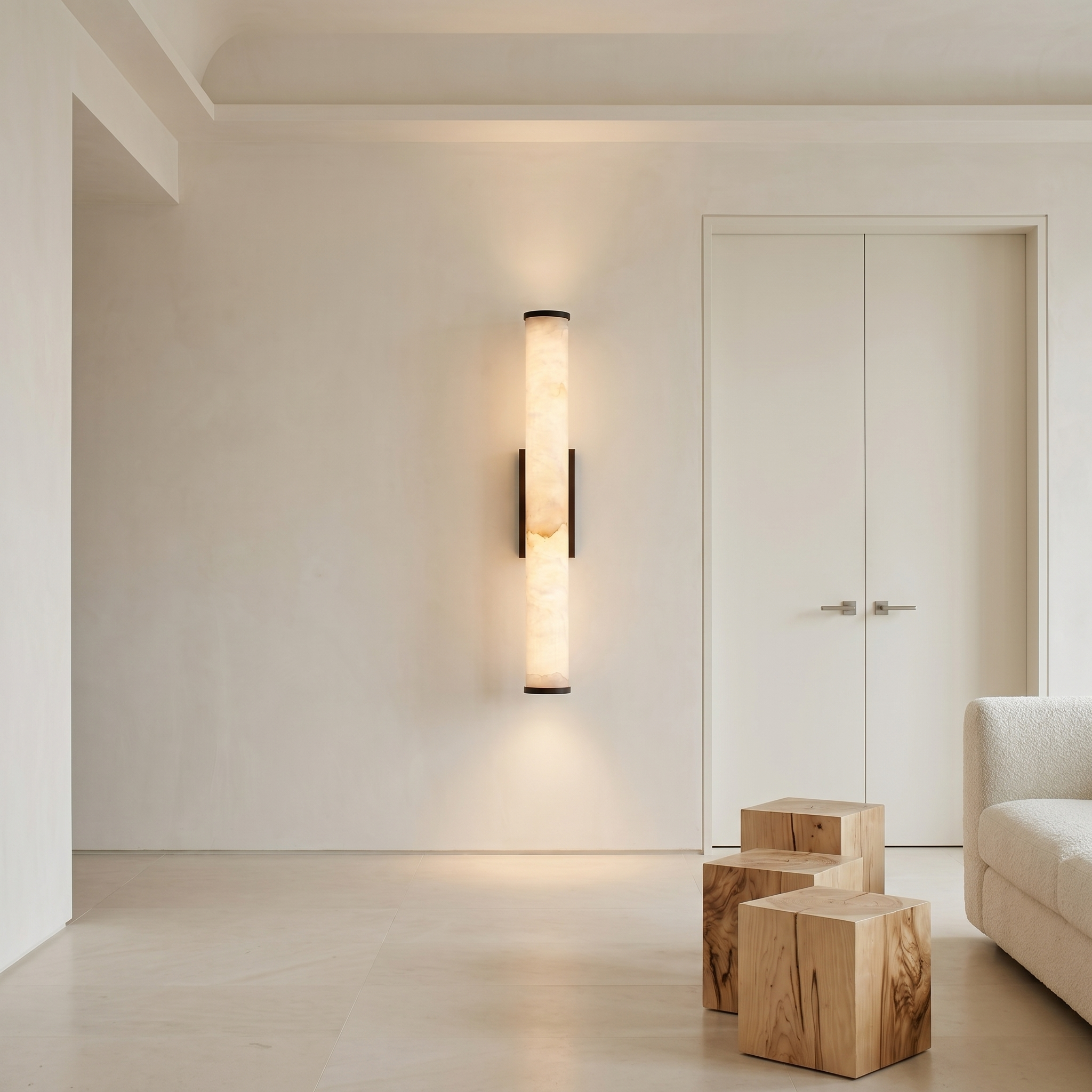 Cloud Stone Resin Cylindrical Matte Black 14W LED wall sconce at three-quarter angle in a study room with warm light glowing