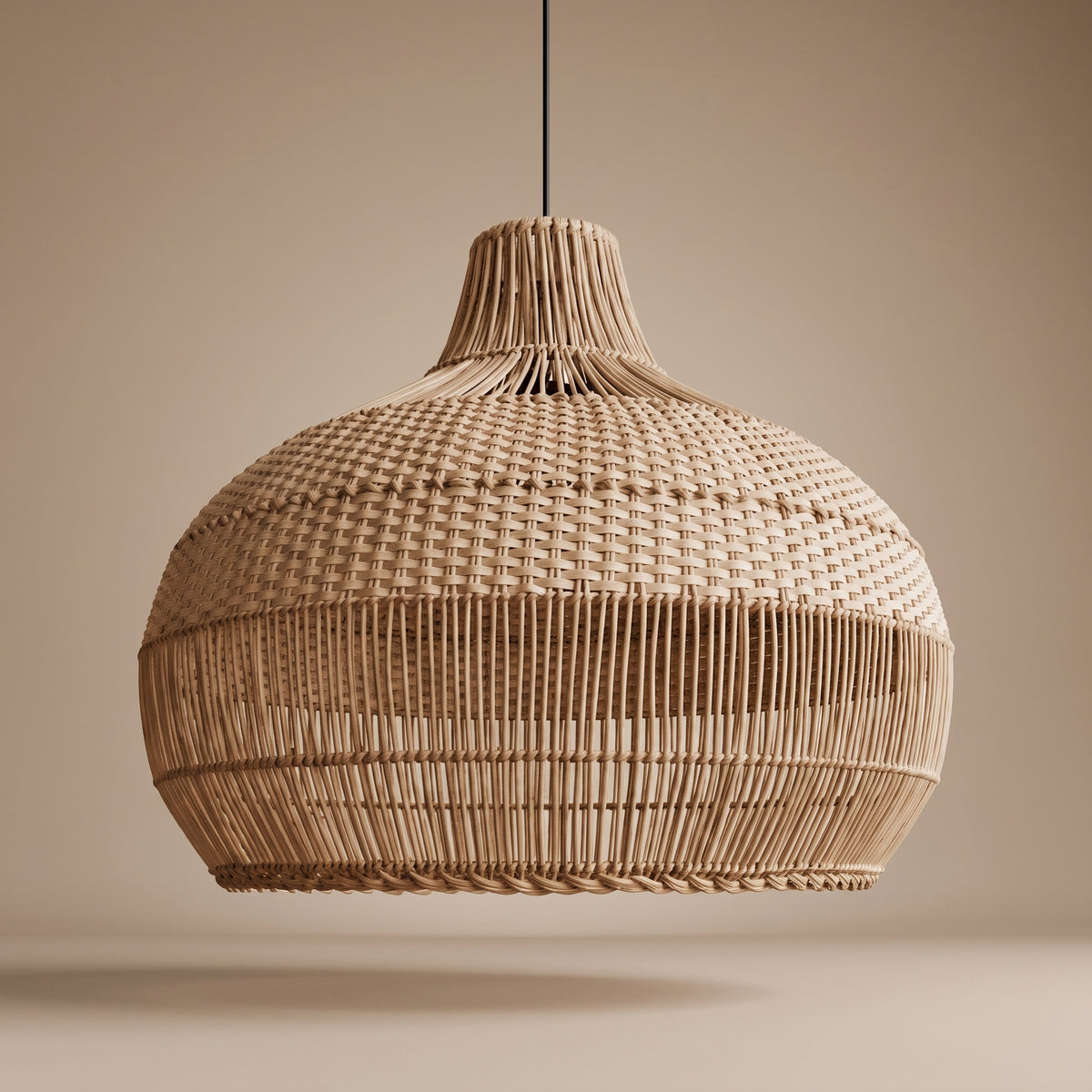 Handwoven rattan bulb-shaped pendant lamp shade unlit, three-quarter view showing the natural weave