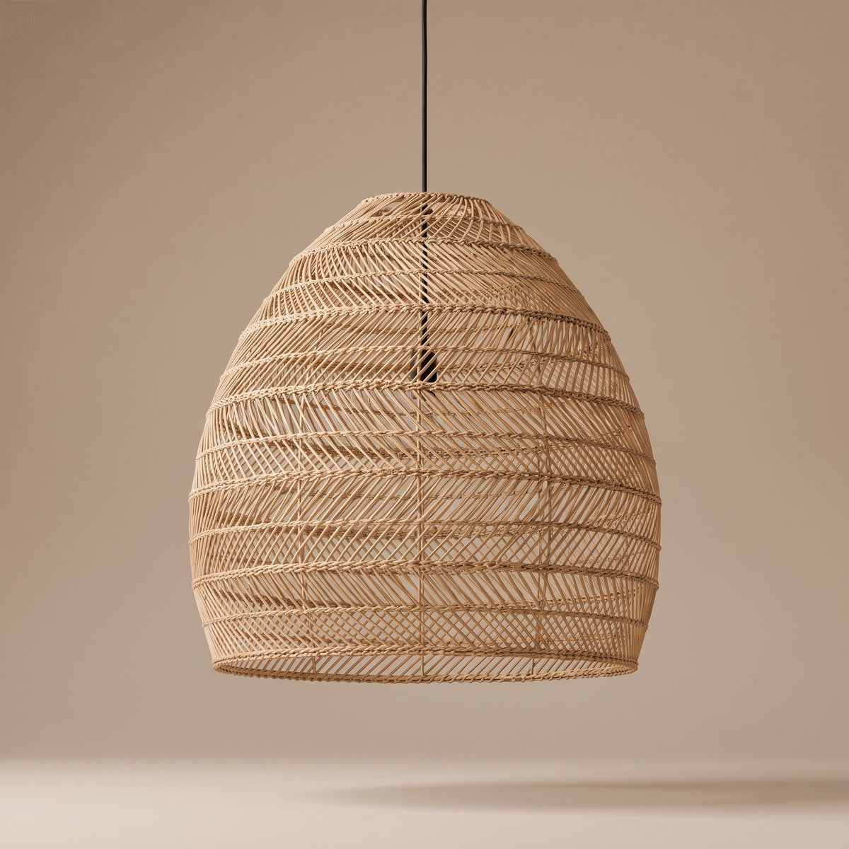 Wicker cloche pendant lamp shade unlit, three-quarter view showing the natural texture