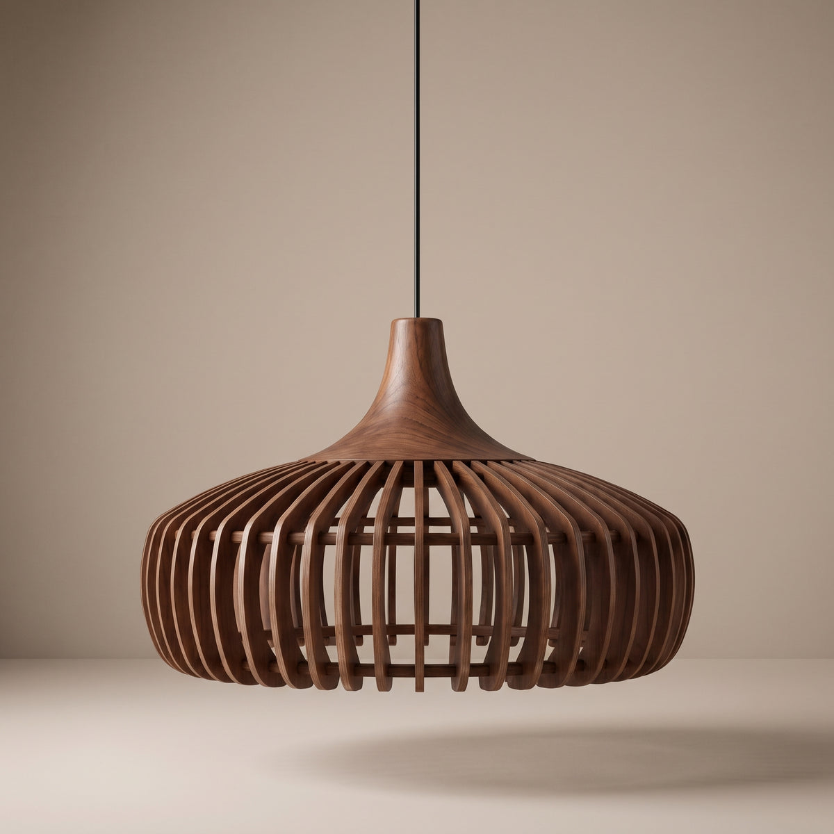 Curved wood slat pendant lamp shade in walnut finish on a beige studio background
