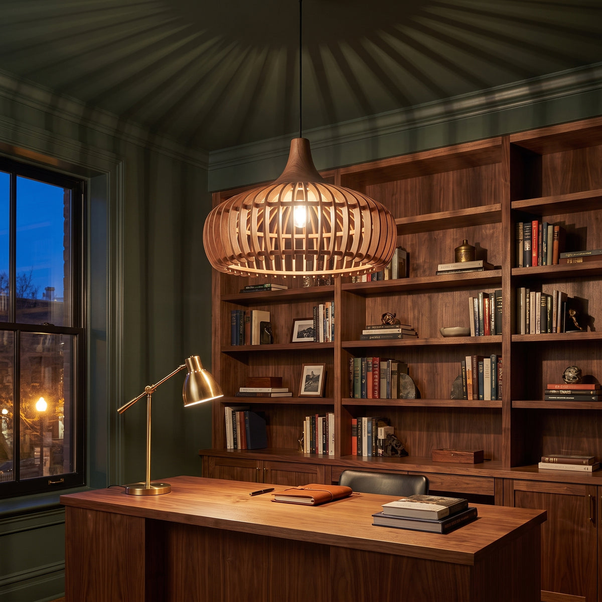 Curved wood slat pendant lamp shade in walnut above a home office desk