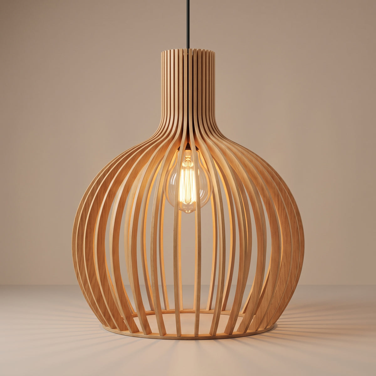 Handcrafted wooden slat cage pendant lamp shade lit with a warm glow on a beige studio background