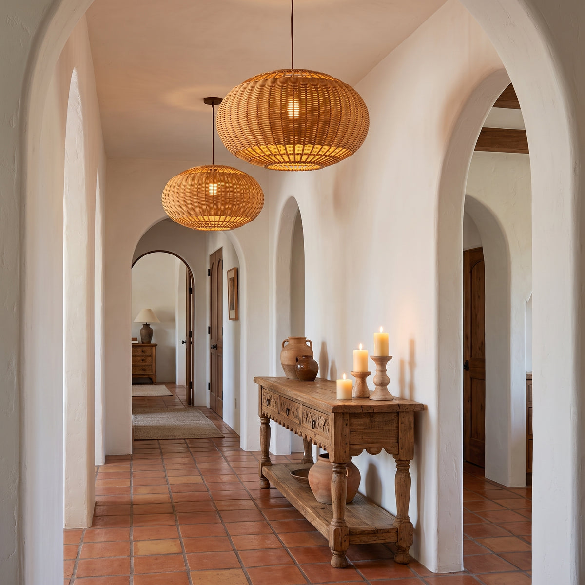 Wide wicker globe pendant lamp shade along a Spanish Revival hallway