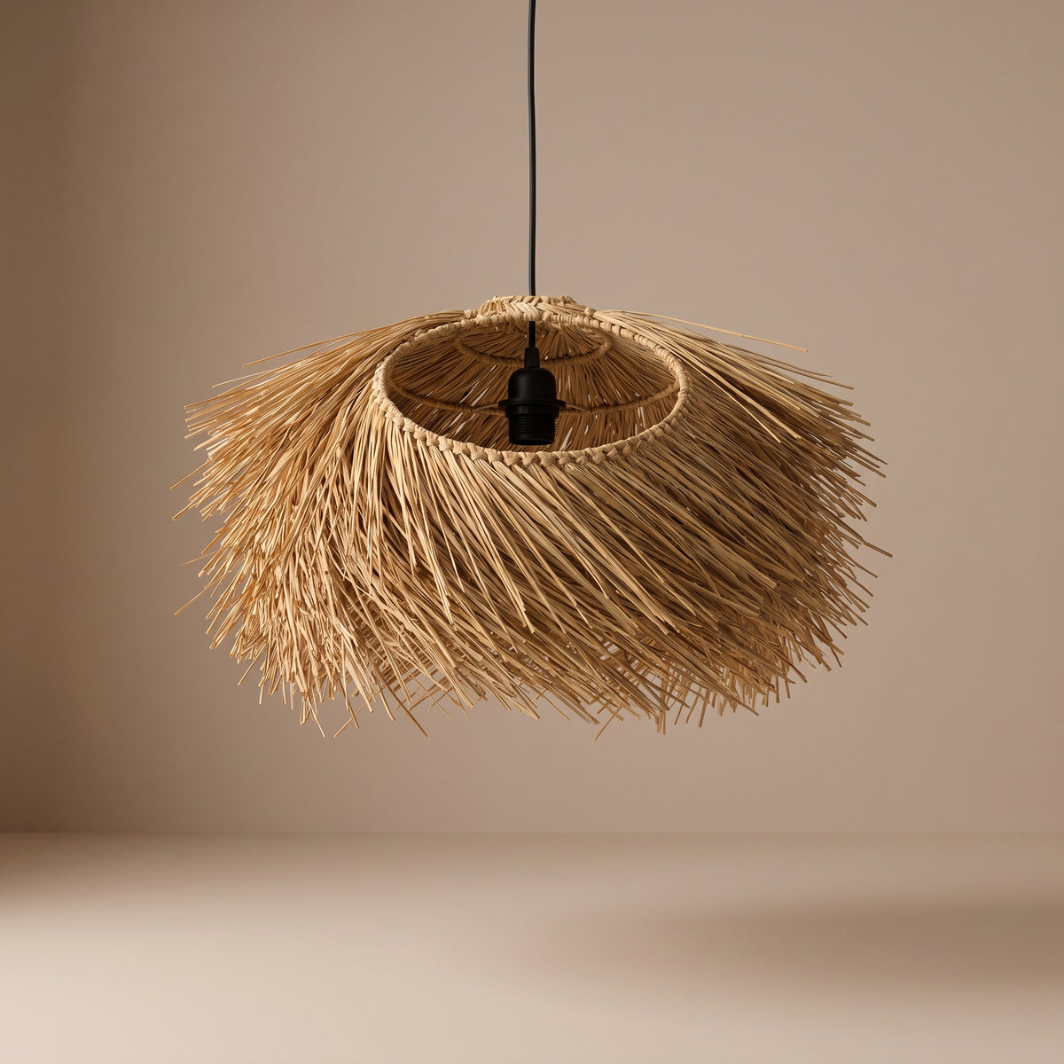 Straw fringe pendant lamp shade unlit, three-quarter view showing the natural texture