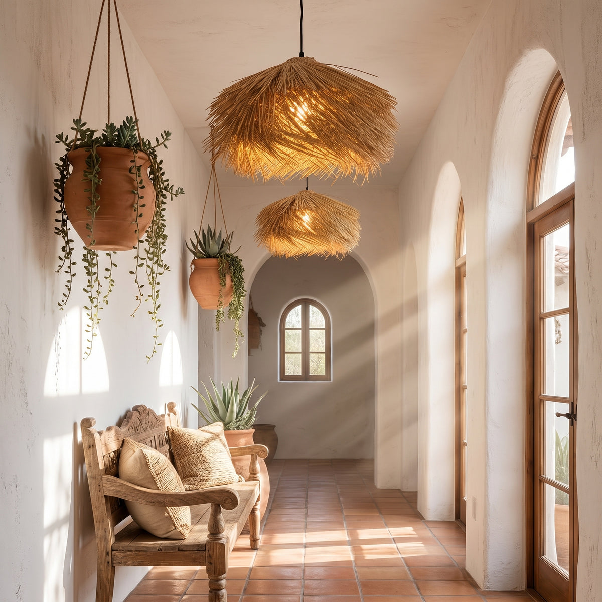 Straw fringe pendant lamp shade along a Spanish-style hallway