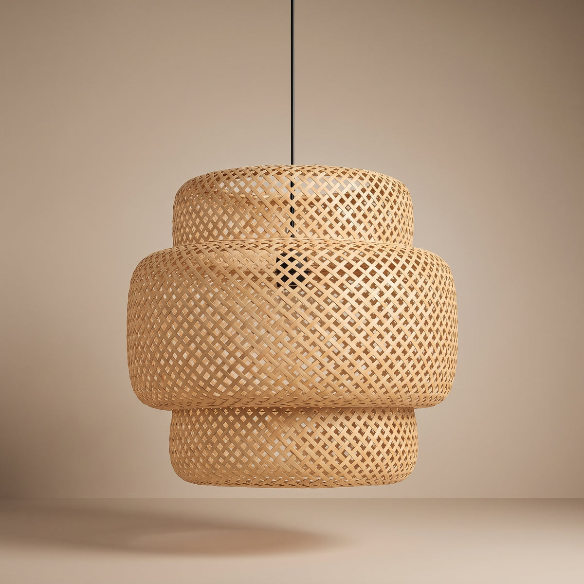 Layered bamboo pendant lamp shade unlit, three-quarter view showing the natural texture