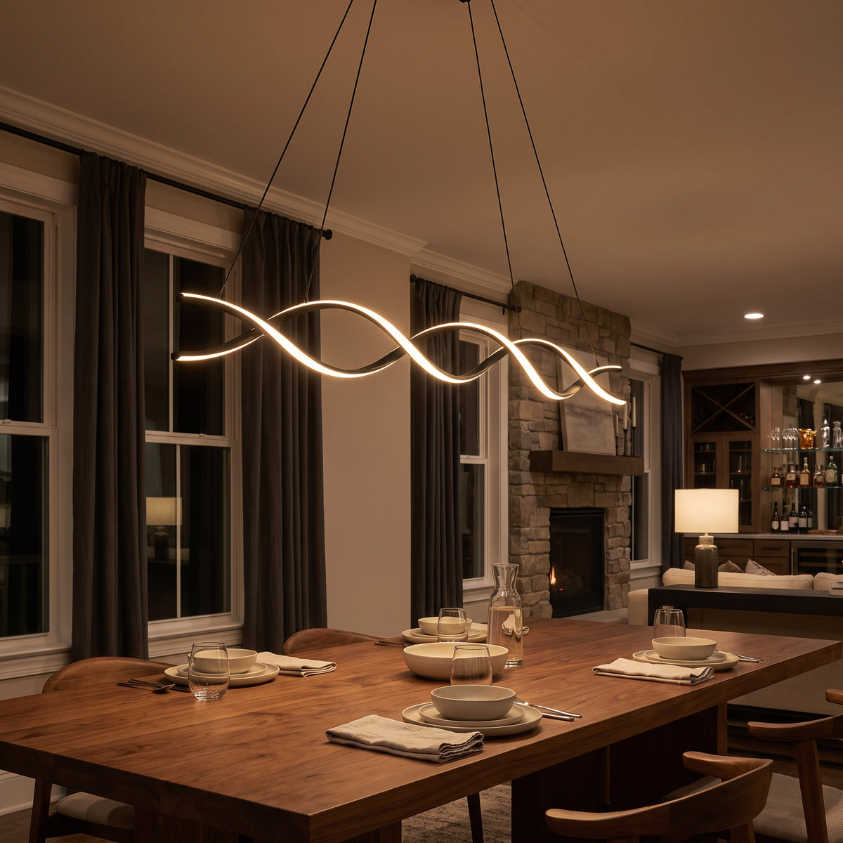 Ondine wave linear LED pendant above a dining table