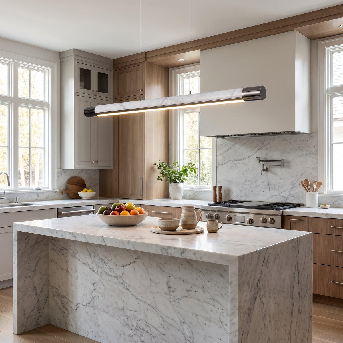 Carrara Line marble linear pendant above a kitchen island