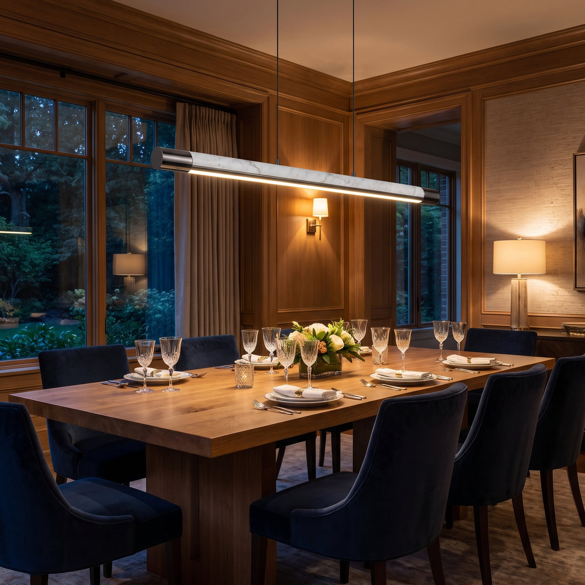 Carrara Line marble linear pendant above a dining table