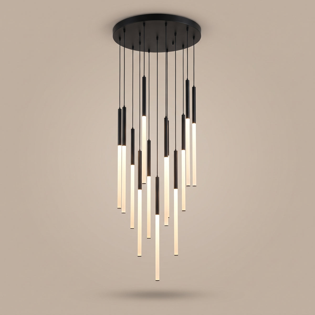 Cascade LED tube cluster chandelier, lit, studio view