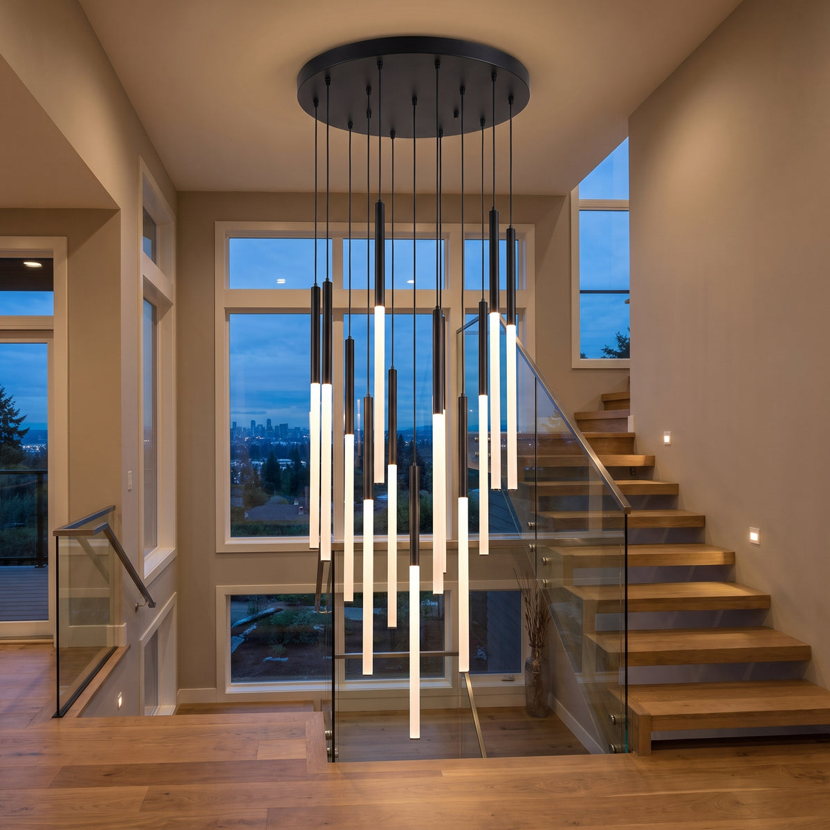Cascade cluster chandelier in a modern stairwell