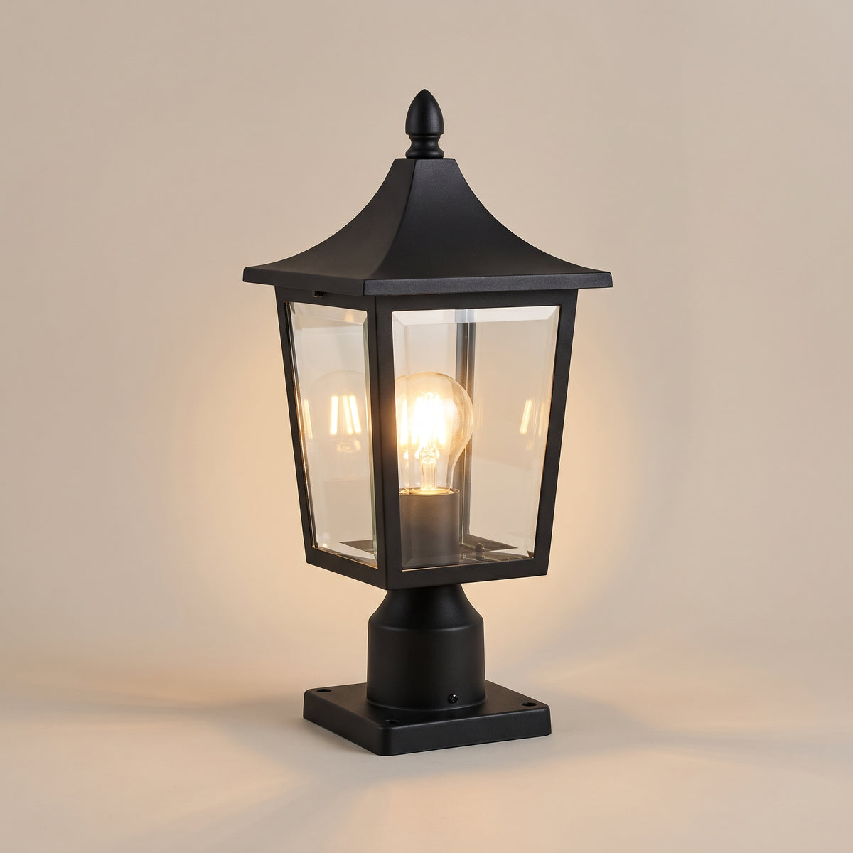Hollis traditional black pillar lantern, lit, studio view