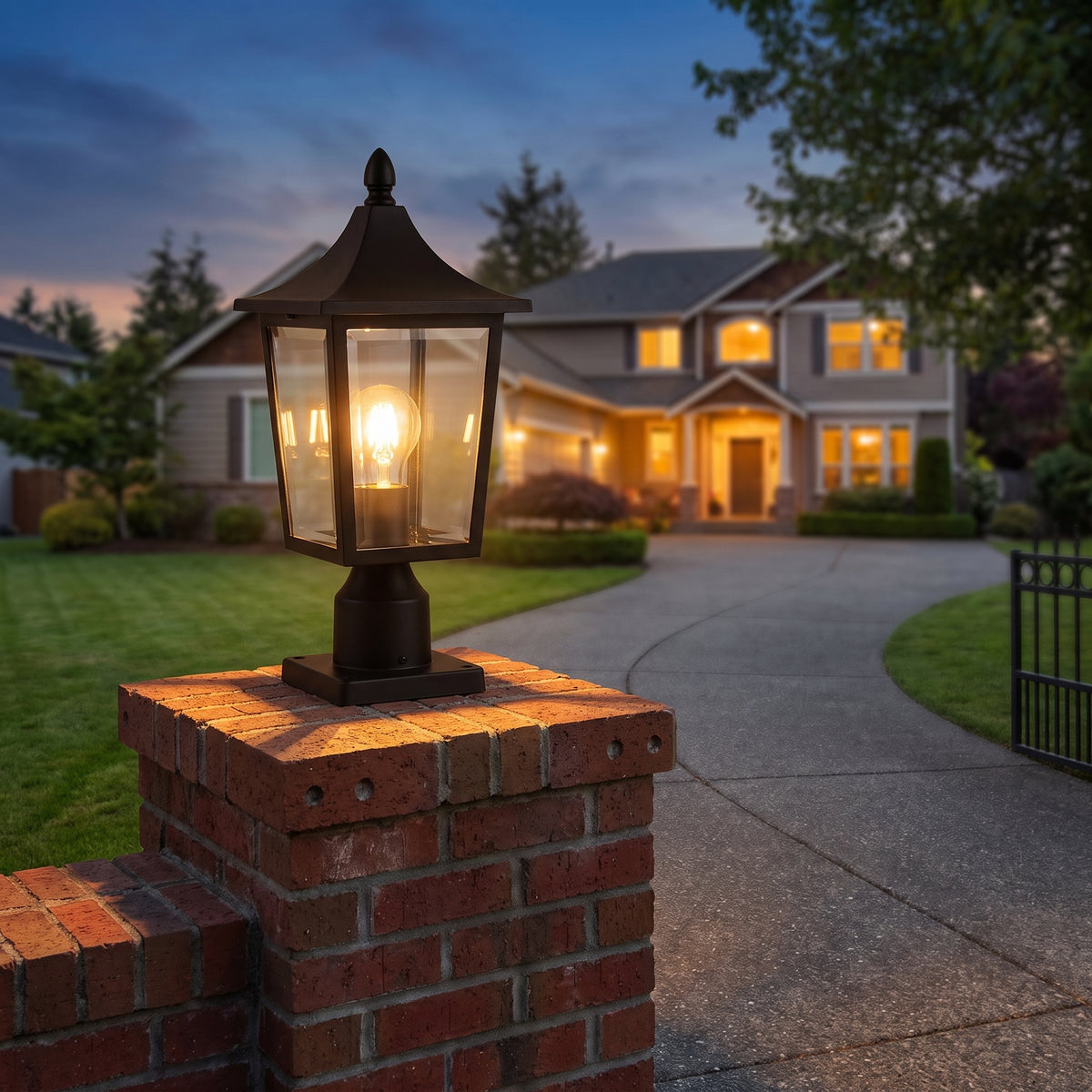 Hollis pillar lantern on a brick gate post at dusk