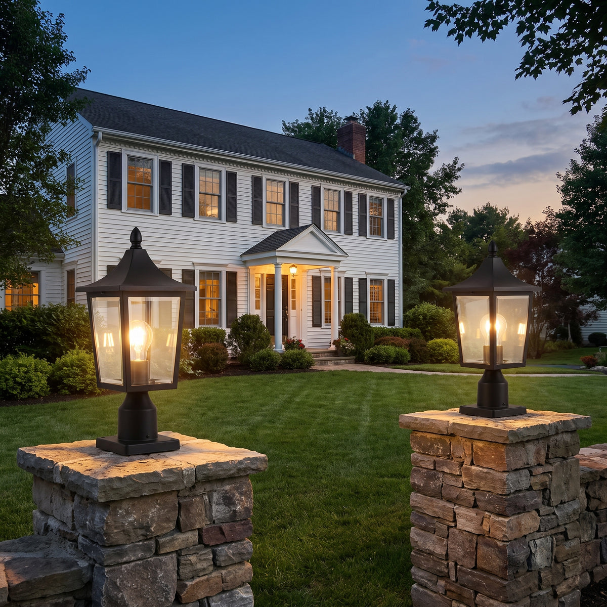 Pair of Hollis pillar lanterns at a home entrance