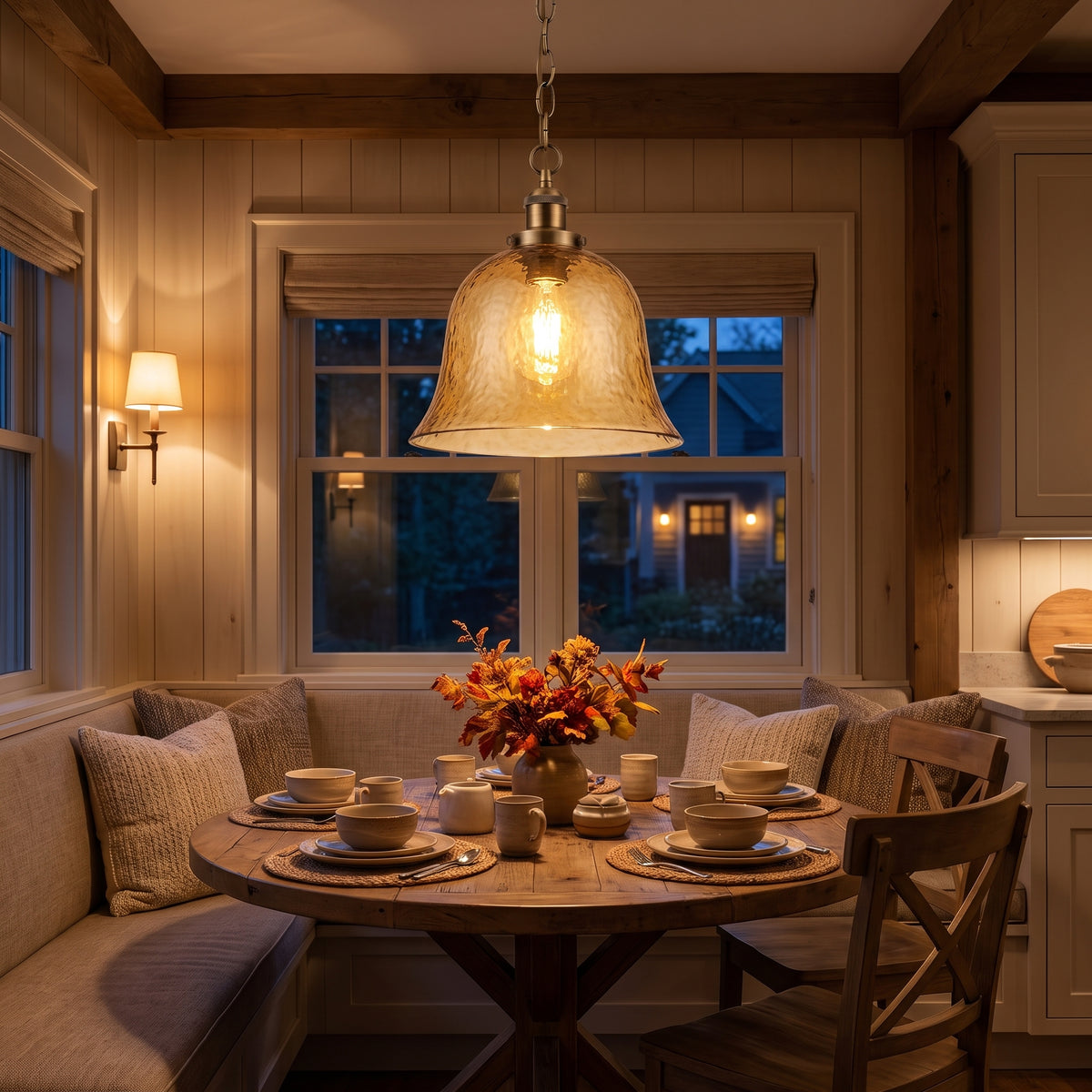 Ambra amber glass pendant above a breakfast nook