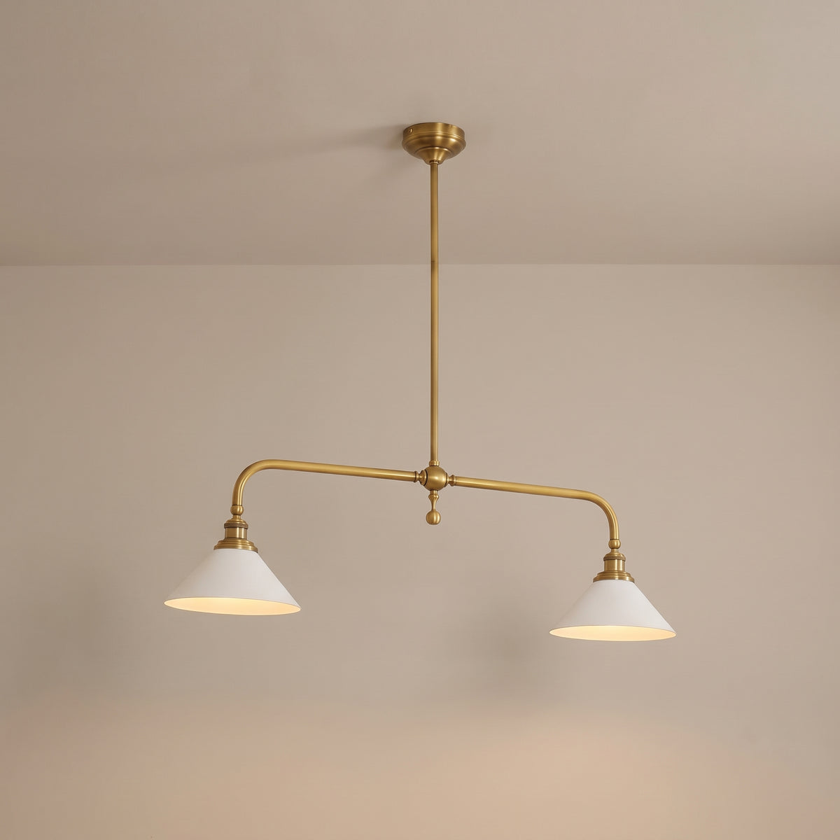 Ashbury brass 2-light linear pendant with white shades, lit, studio view
