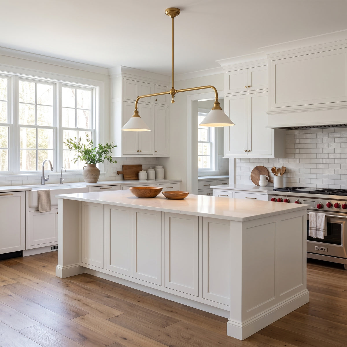 Ashbury brass linear pendant above a classic kitchen island