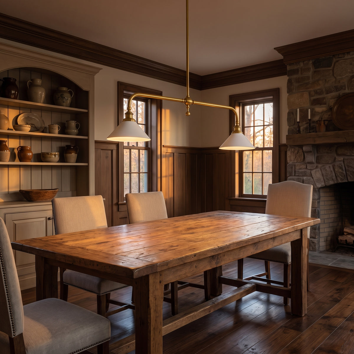 Ashbury brass linear pendant above a farmhouse dining table
