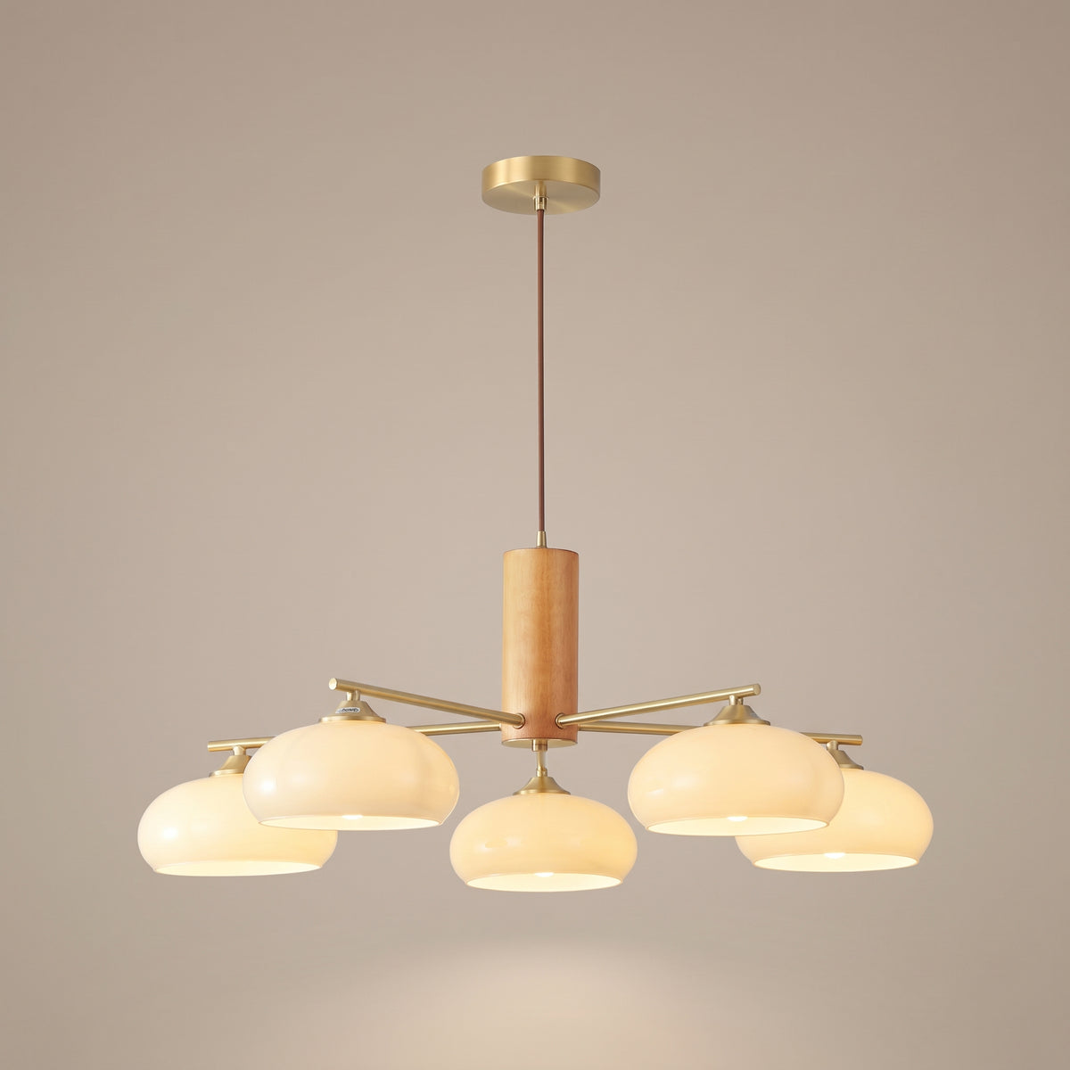 Kaki persimmon glass chandelier with wood and brass, lit, studio view