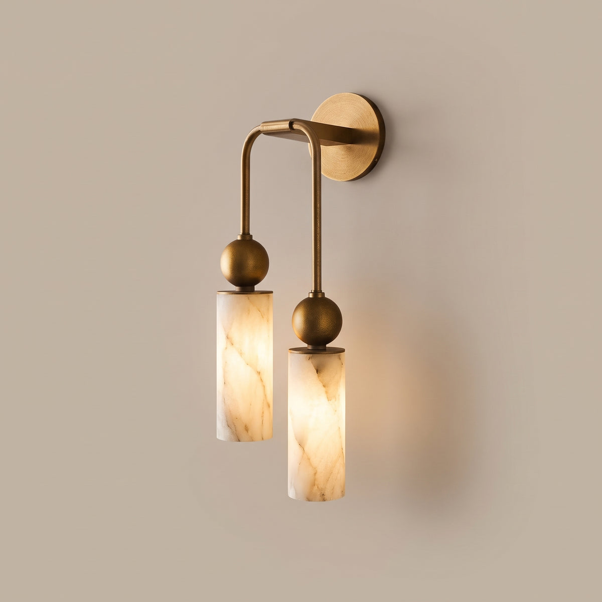 Alba alabaster column wall sconce in burnished brass, lit