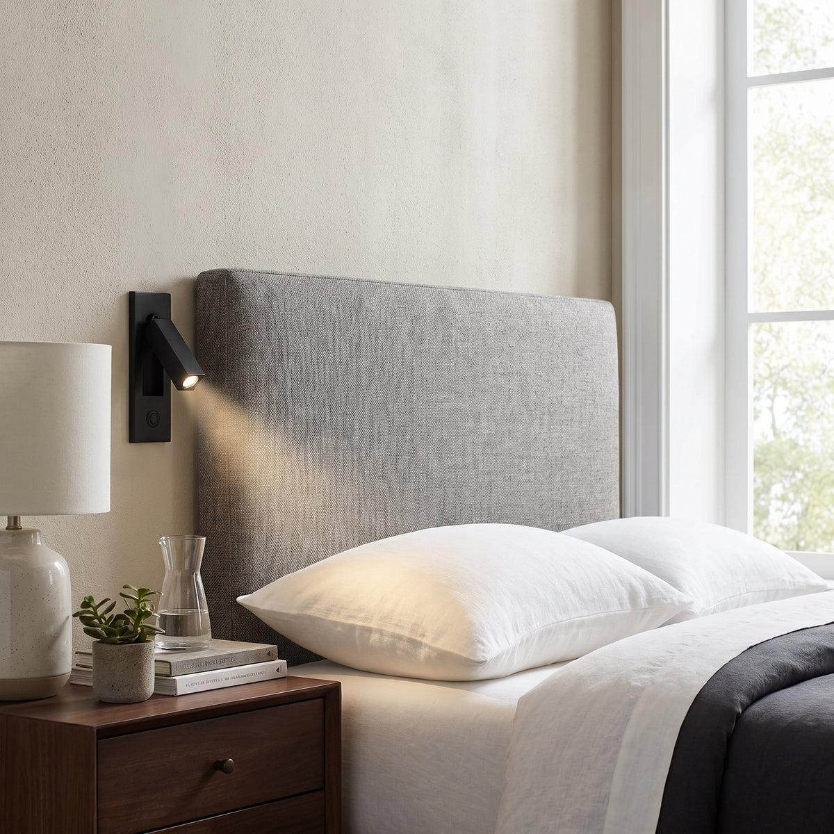 Nook recessed reading light above a nightstand in a modern bedroom