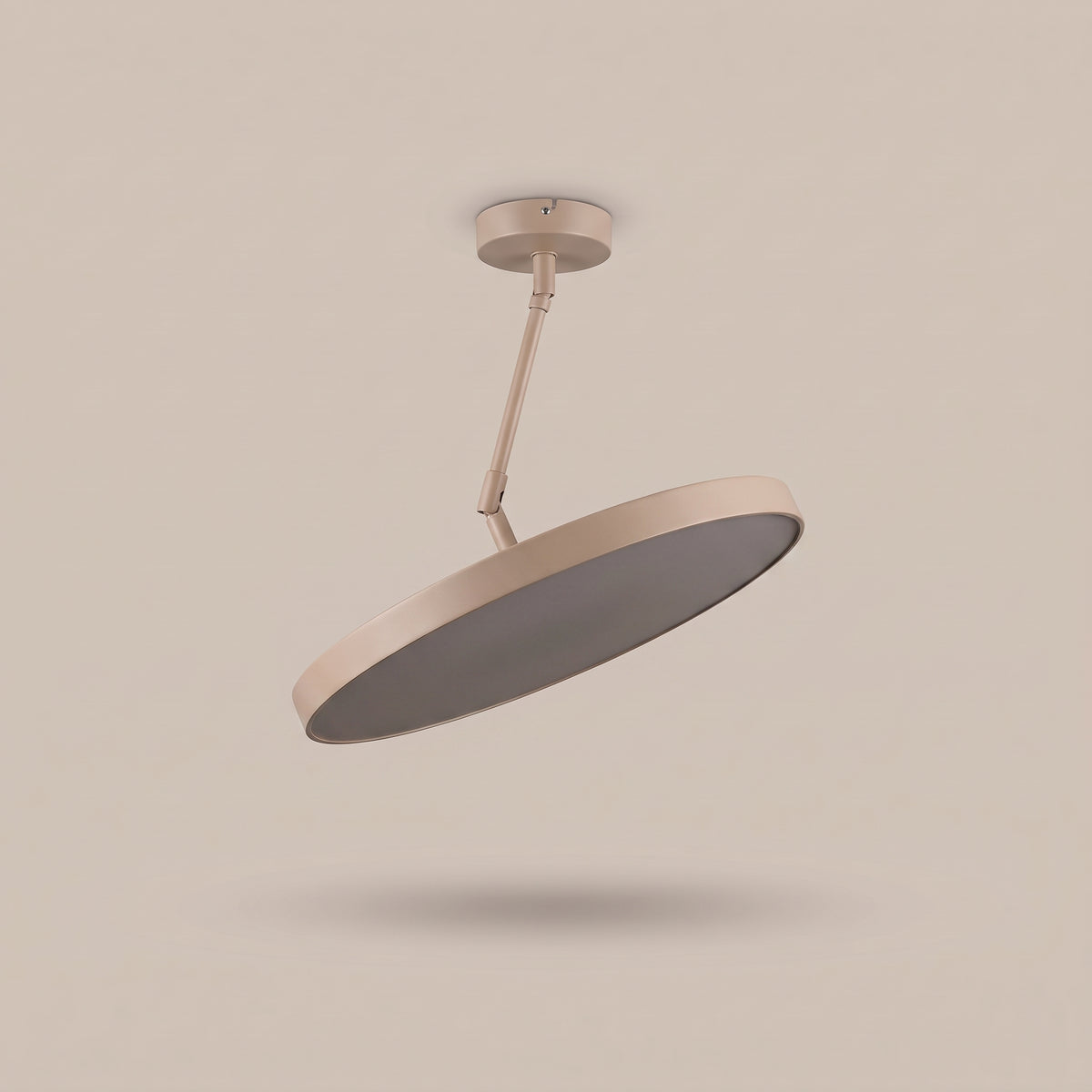 Sway tilting disc LED ceiling light, three-quarter view, unlit