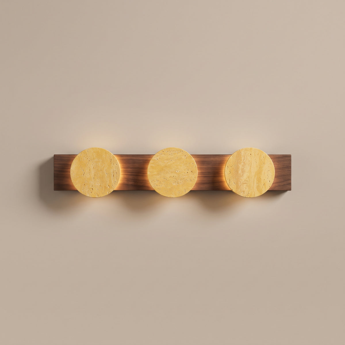Tivoli travertine disc and walnut wall sconce, lit, studio view