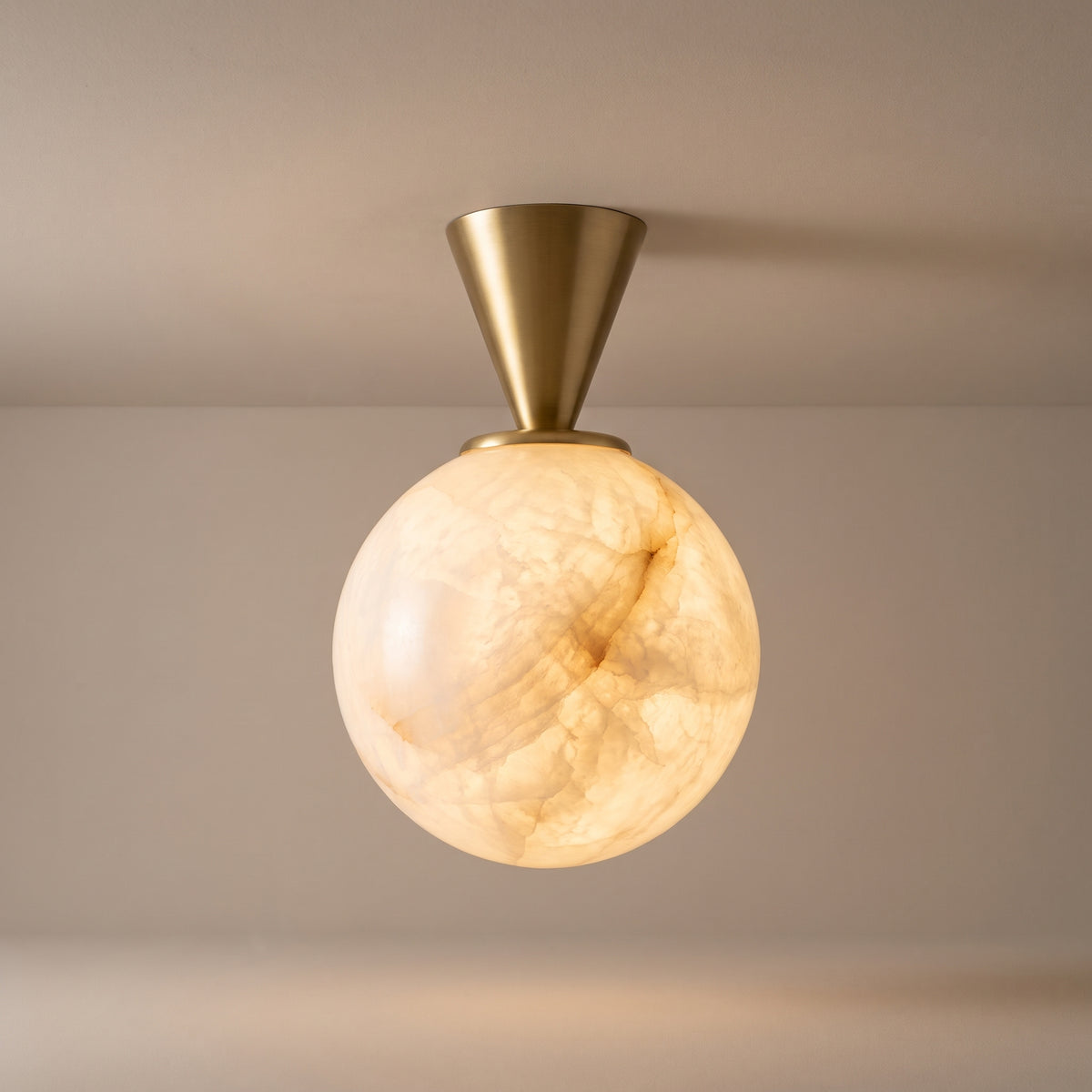 Lunaire alabaster sphere ceiling light, lit