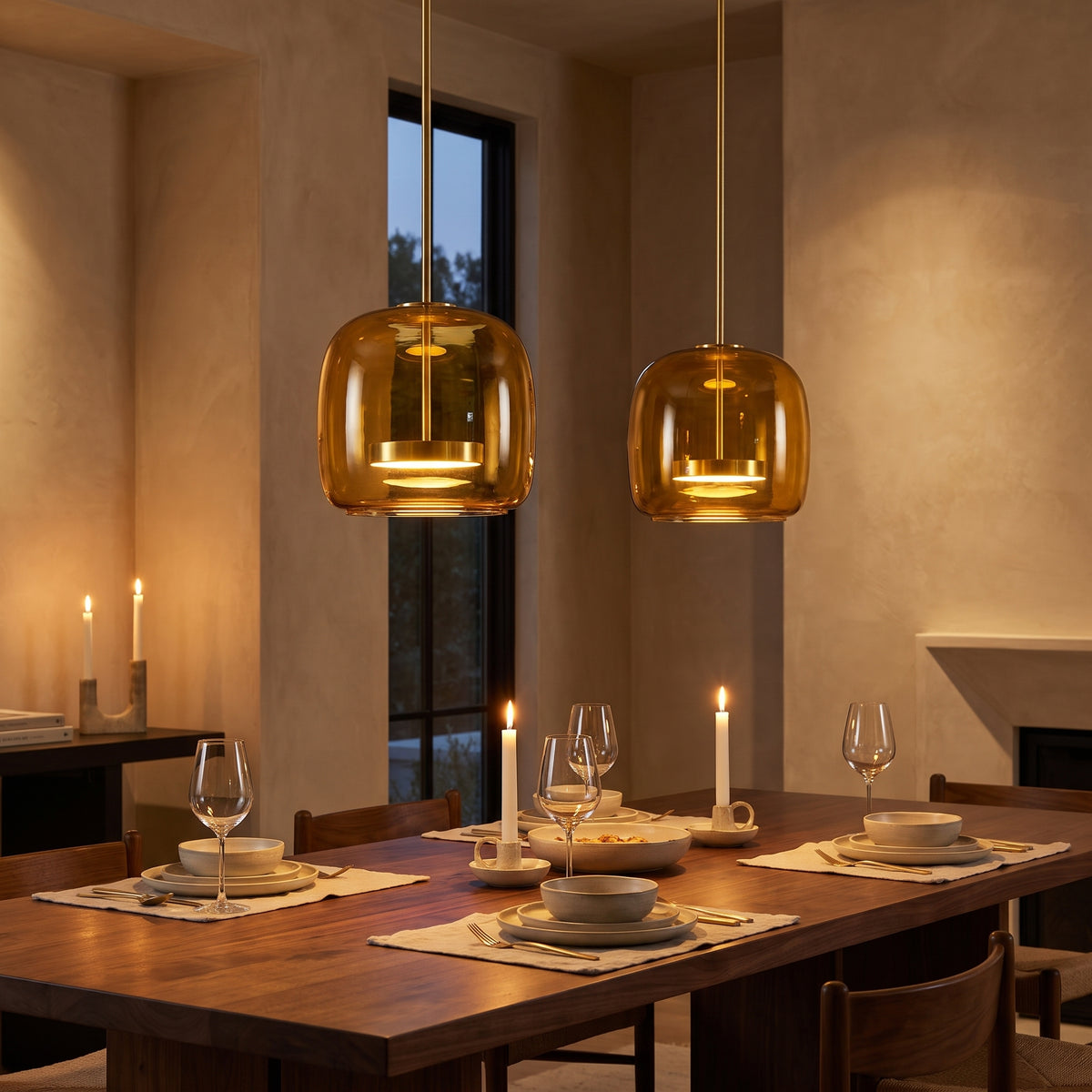 Orbe amber glass pendants over a dining table