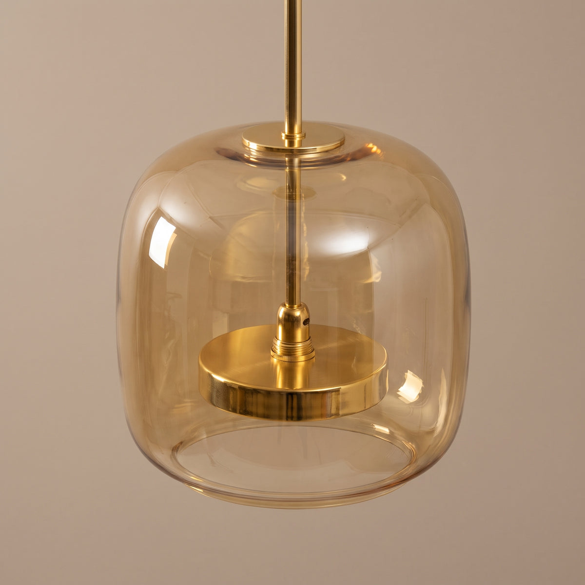 Orbe amber glass and gold pendant
