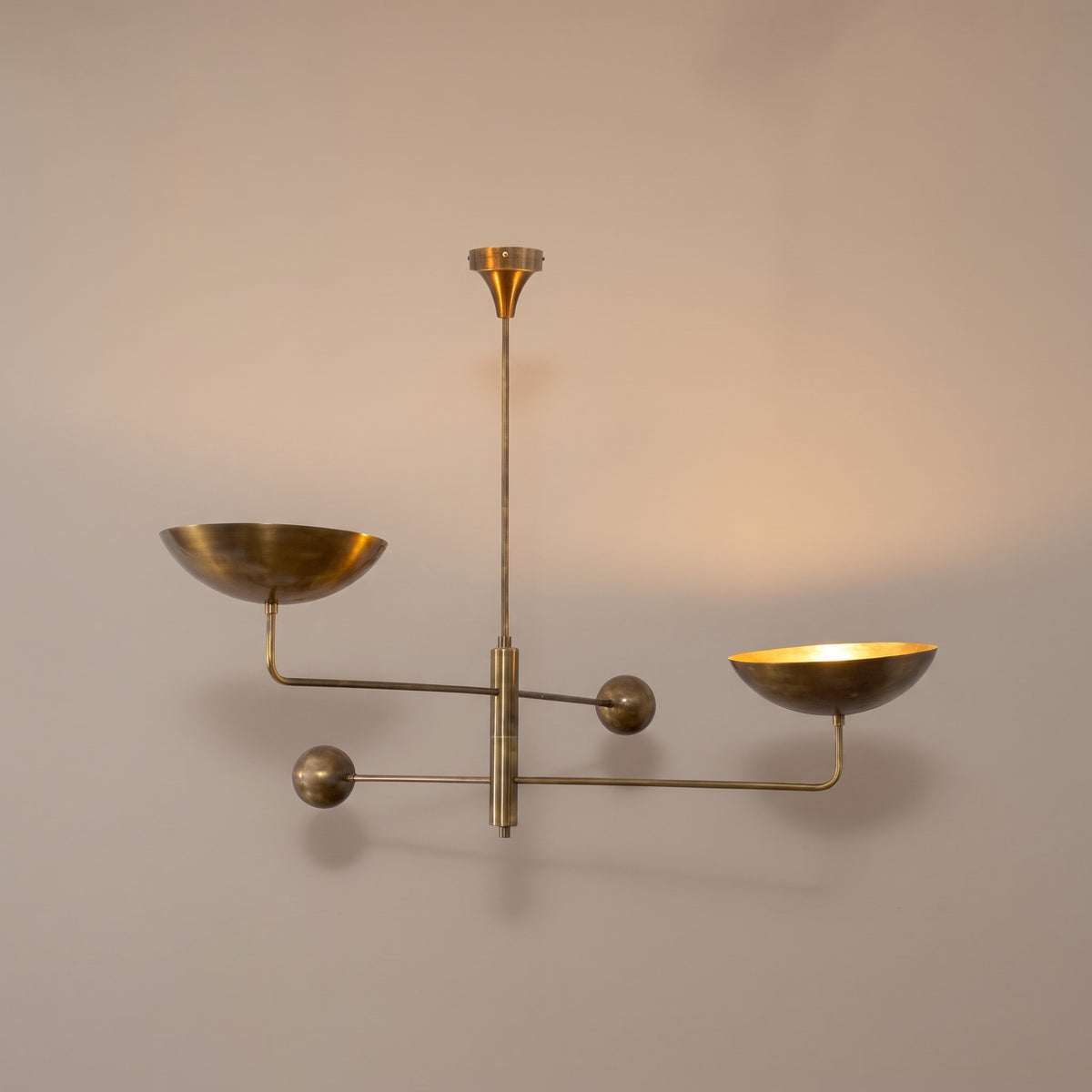 Nauta two-arm brass uplight chandelier