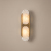 Capsule twin alabaster capsule wall sconce - studio photo, light on