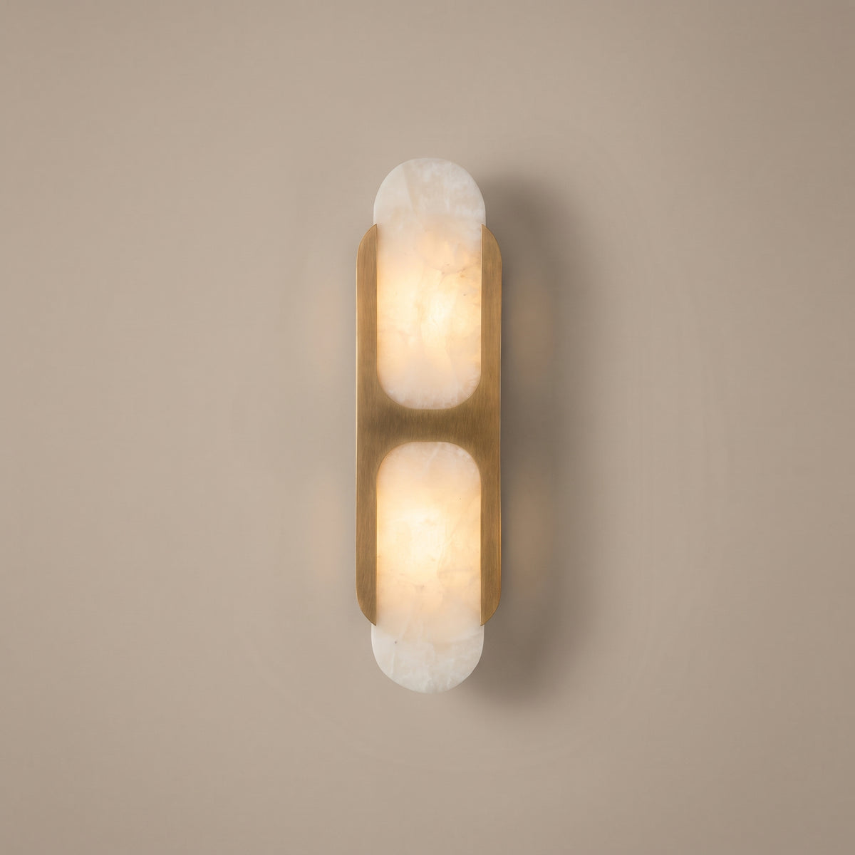 Capsule twin alabaster capsule wall sconce - studio photo, light on