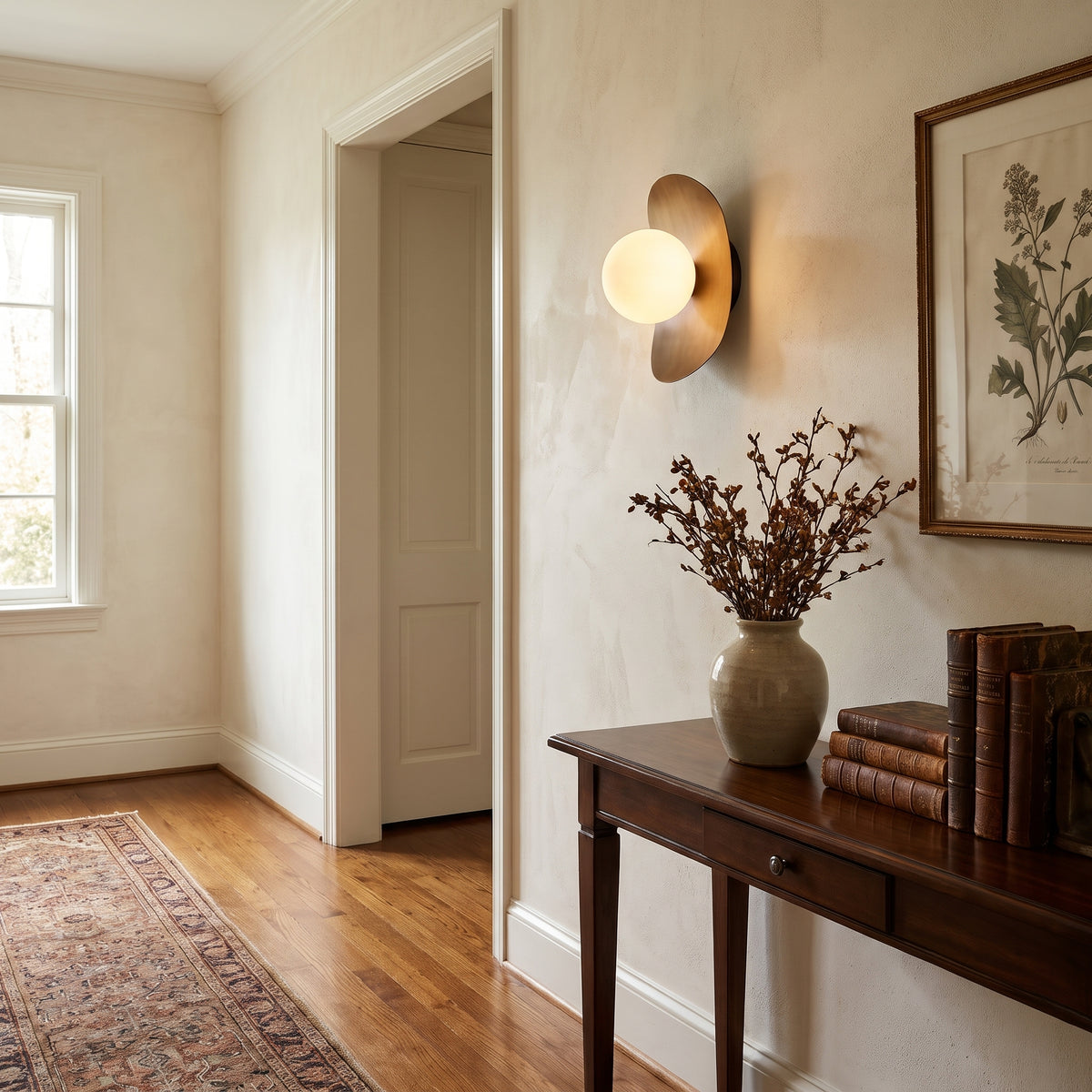 Galet opal globe pebble wall sconce in a hallway