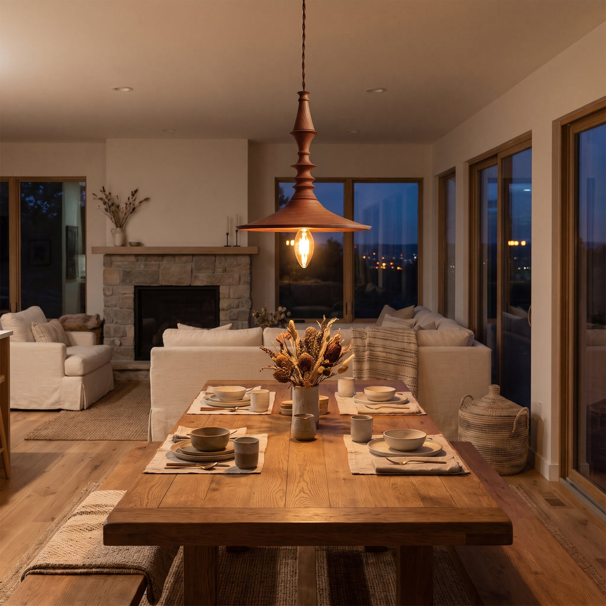 Toupie turned wood pendant light over a dining table