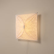 Origami square paper plug-in wall light - studio photo, light on