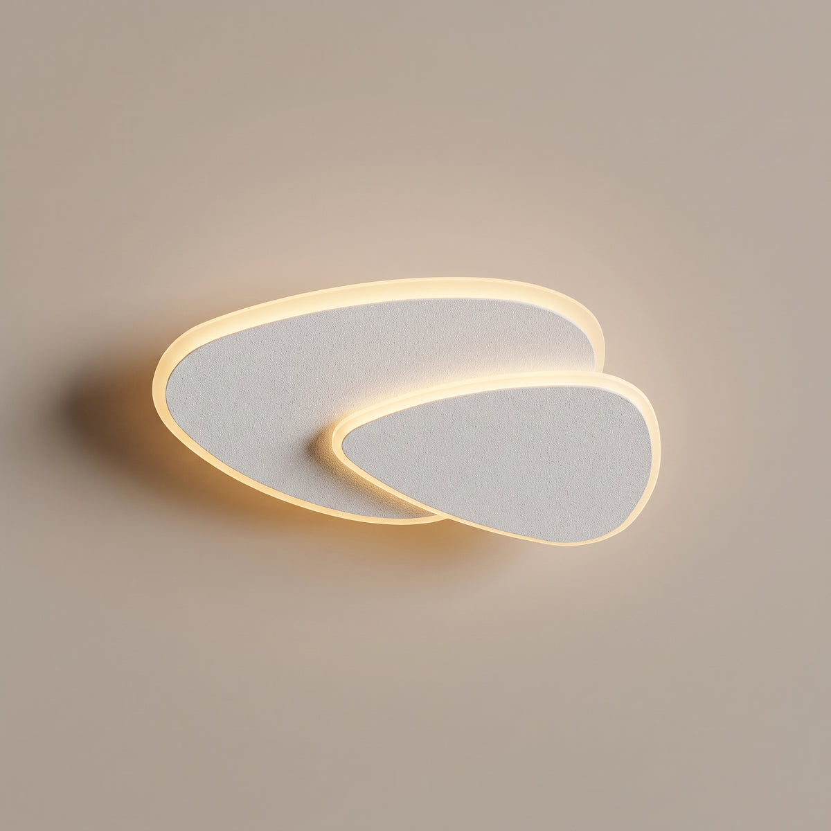 Delta triangle LED flush mount ceiling light - studio photo, light on