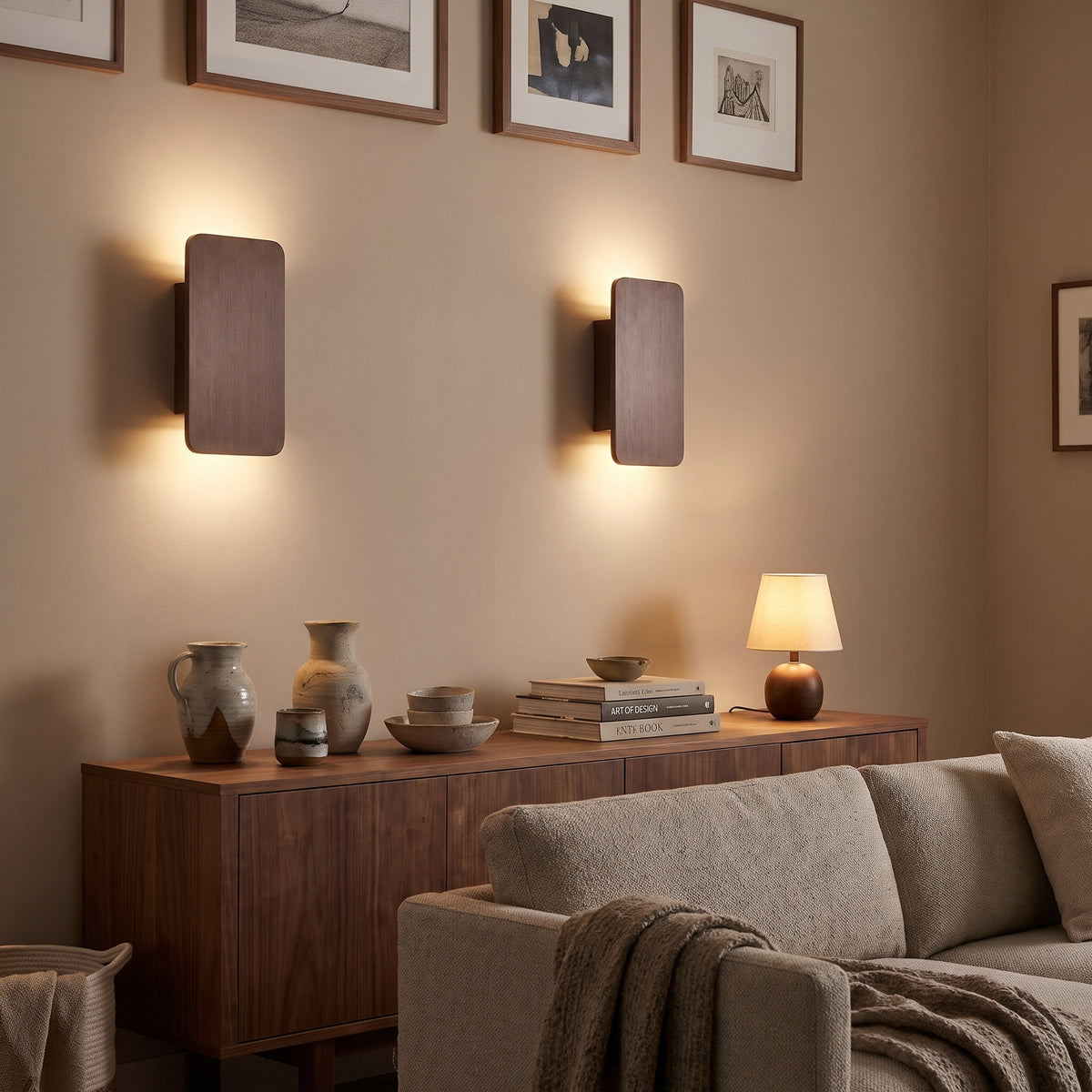 Quadra coffee LED wall sconces above a living room sideboard