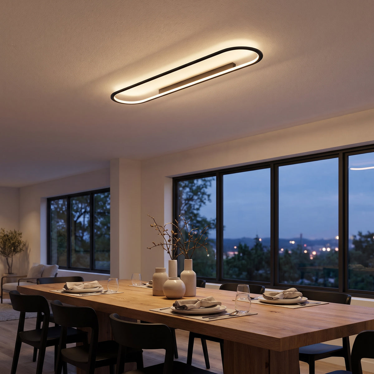 Ovalis oval LED flush mount ceiling light in a modern dining room