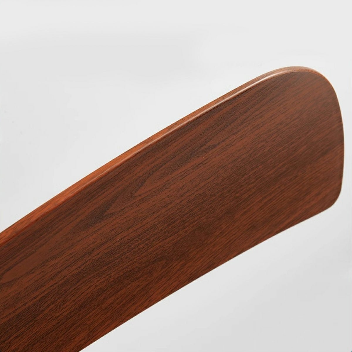 Close-up of an Arden Modern 6-Speed Reverse DC Ceiling Fan blade in a rich wood tone finish, highlighting the natural grain texture.