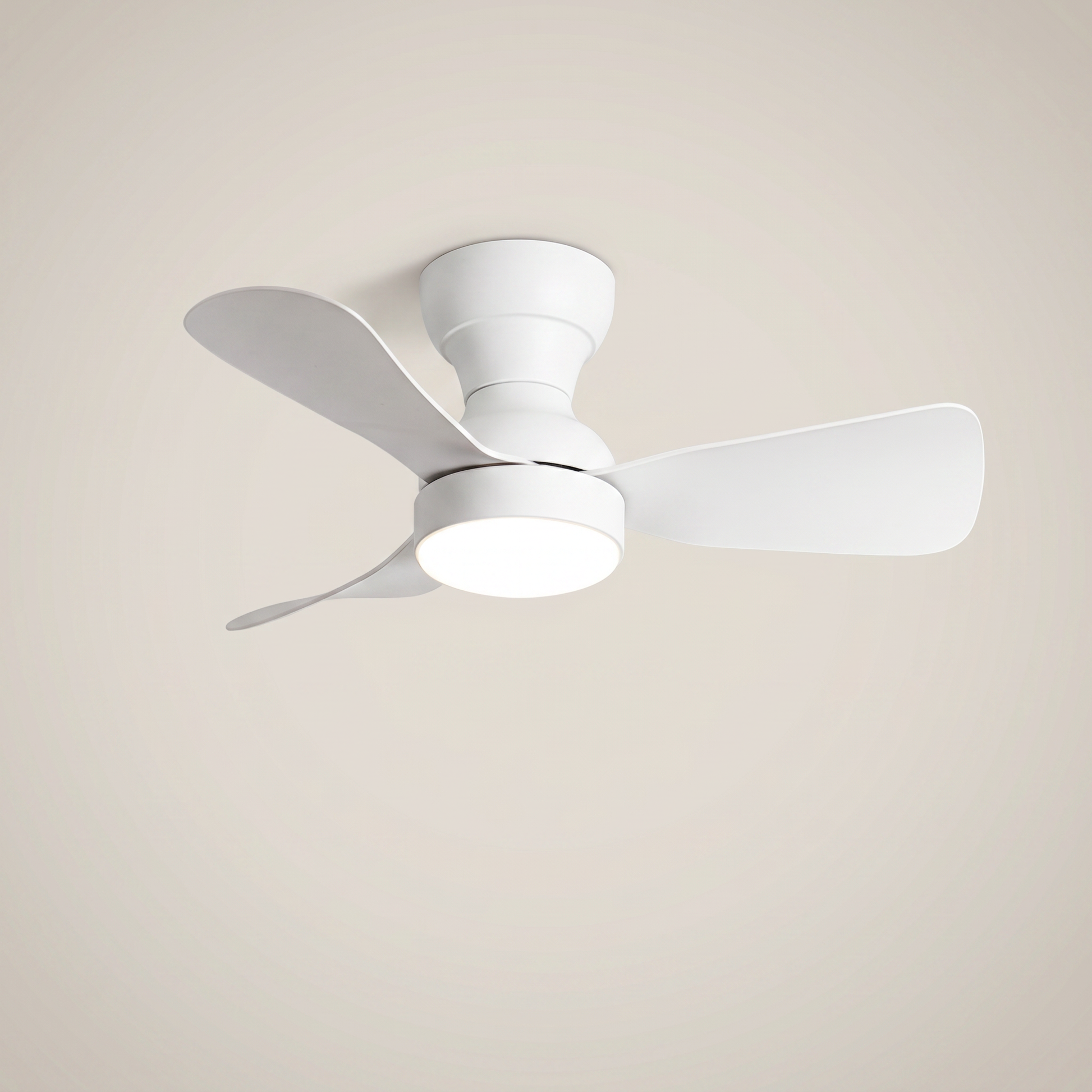 All white ABS flush mount ceiling light with fan shown at three-quarter angle lit with remote control