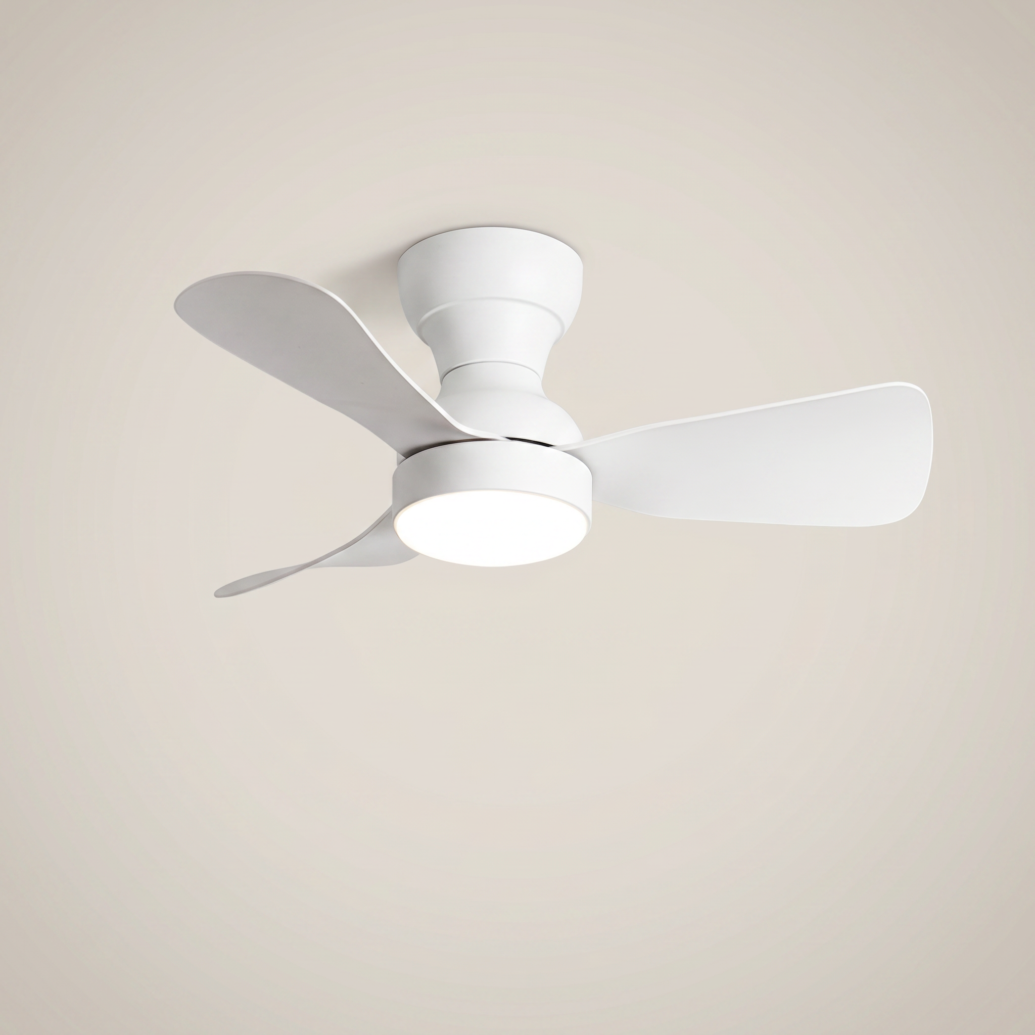 All white ABS flush mount ceiling light with fan shown at three-quarter angle lit with remote control