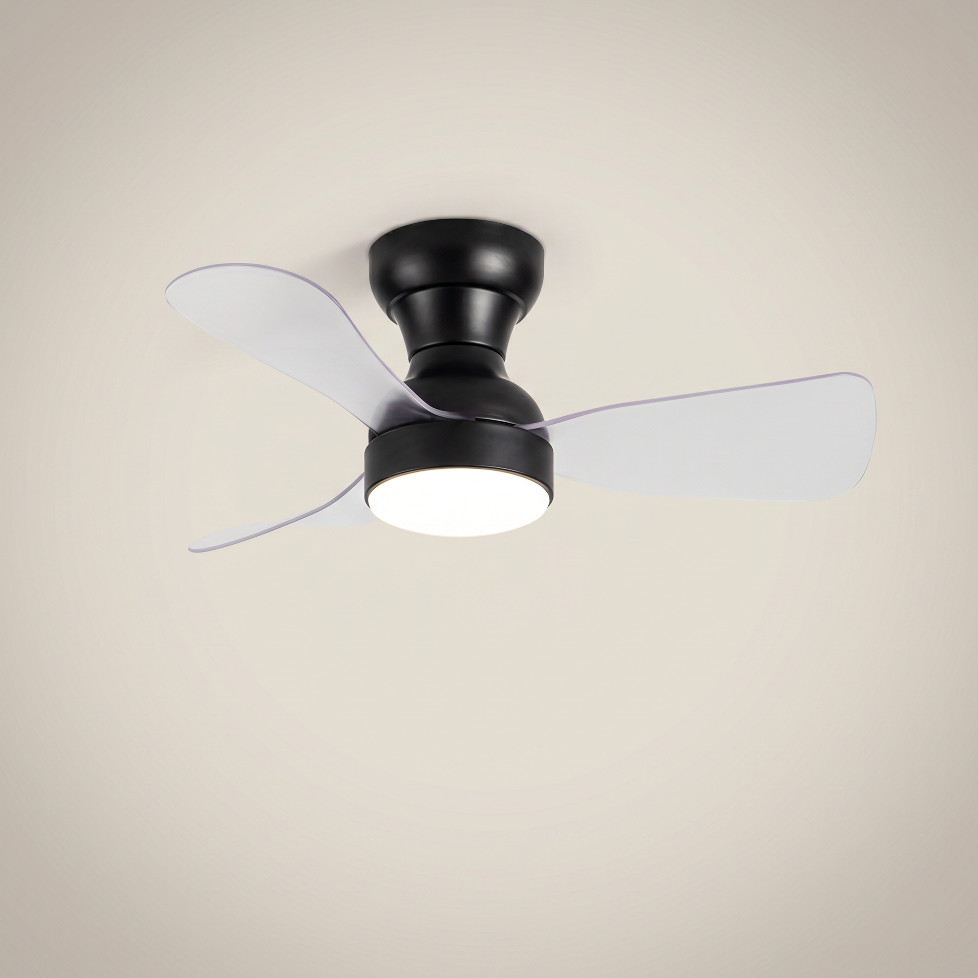 Black ABS flush mount ceiling light with fan at three-quarter angle with clear ABS blades lit