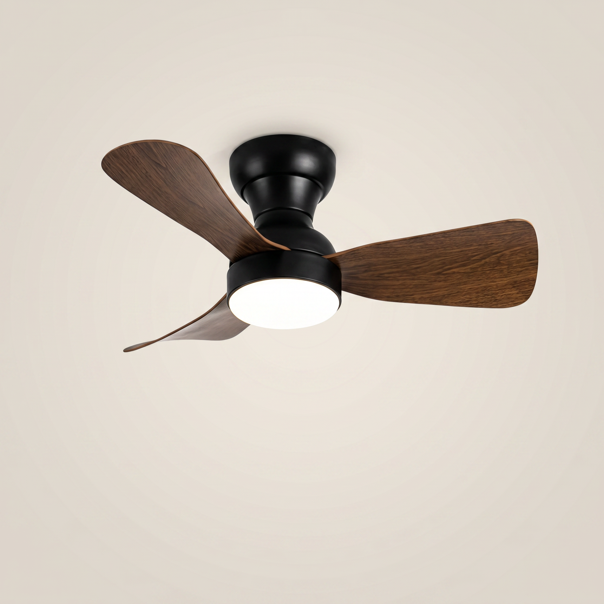 Black ABS flush mount ceiling light with fan at three-quarter angle with dark wood blades lit