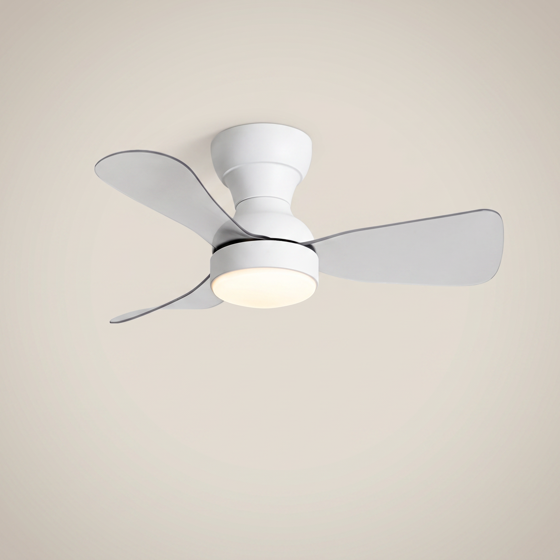 White ABS flush mount ceiling light with fan at three-quarter angle with clear ABS blades lit