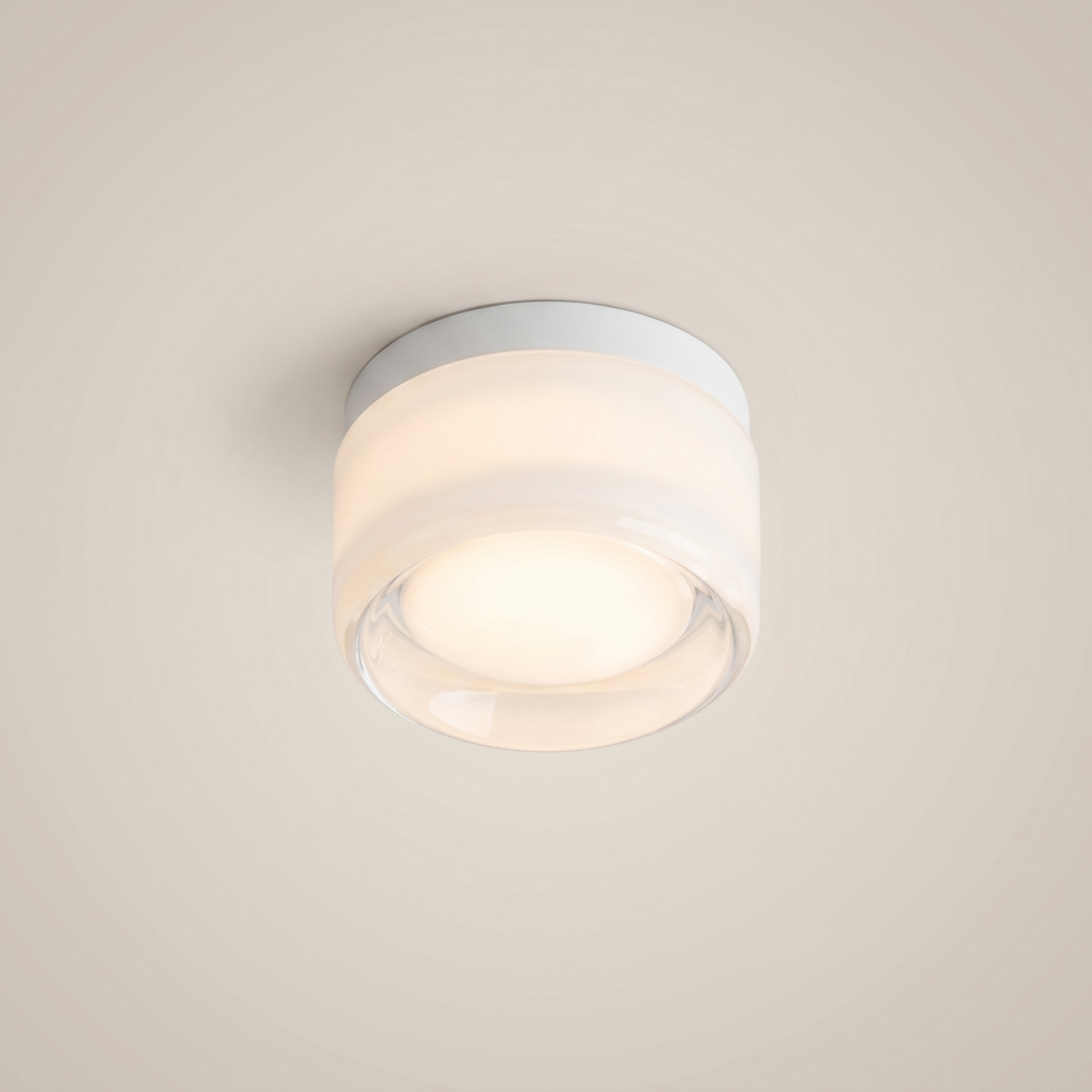 Close-up of Acrylic Smoke Gray Concave three-color dimming 1-light wall sconce showing brushed aluminum trim and smoke gray acrylic with diffused light