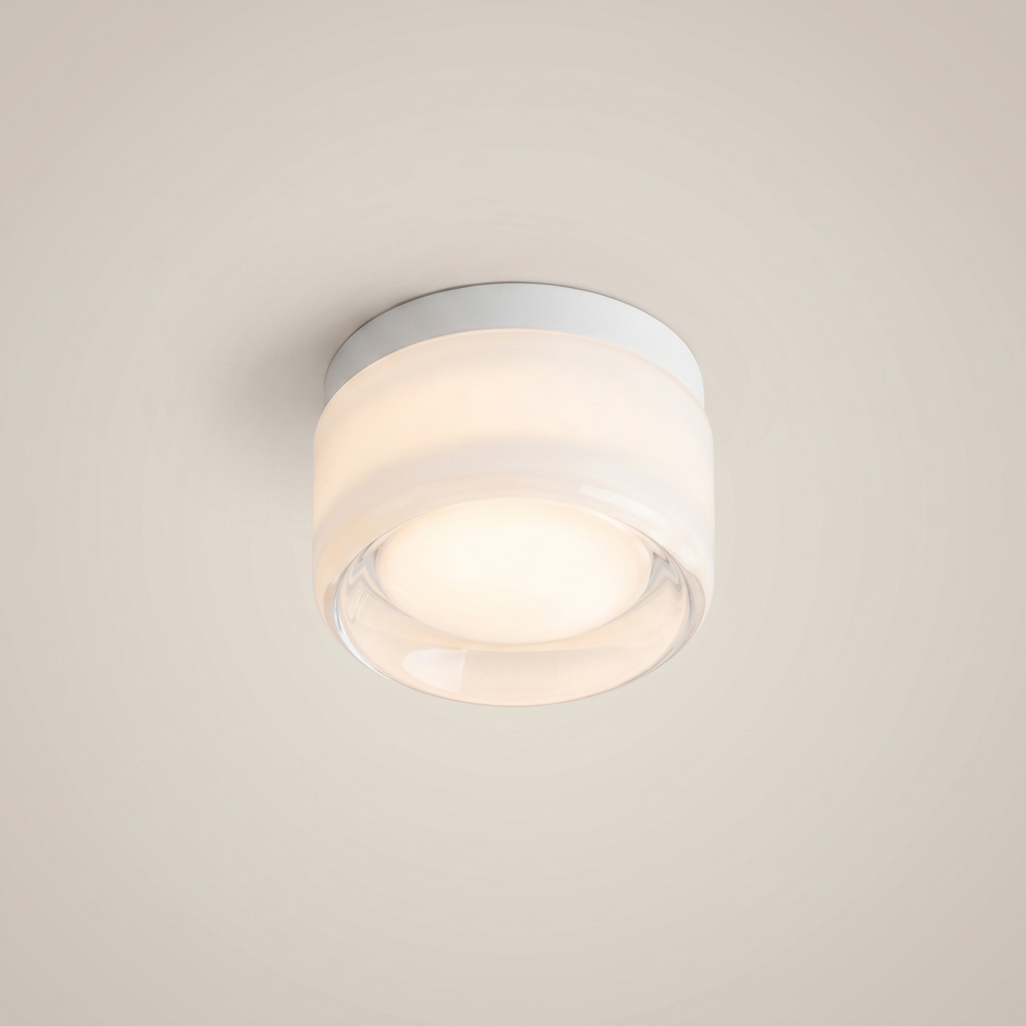 Close-up of Acrylic Smoke Gray Concave three-color dimming 1-light wall sconce showing brushed aluminum trim and smoke gray acrylic with diffused light