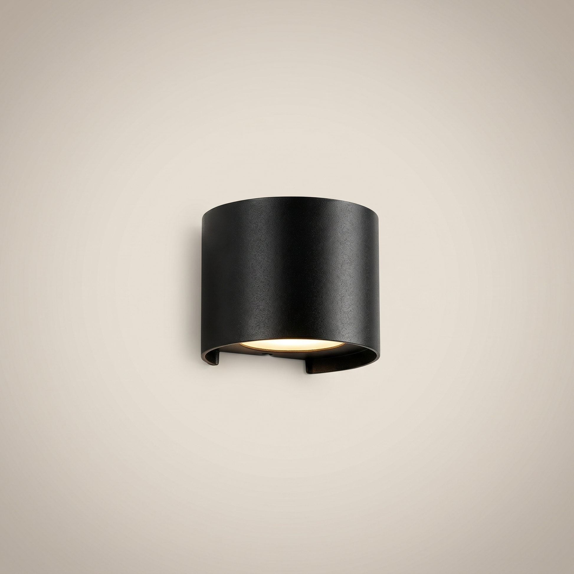 Close-up detail of black aluminum square outdoor wall sconce lit showing sealed IP65 waterproof design and dimmable light