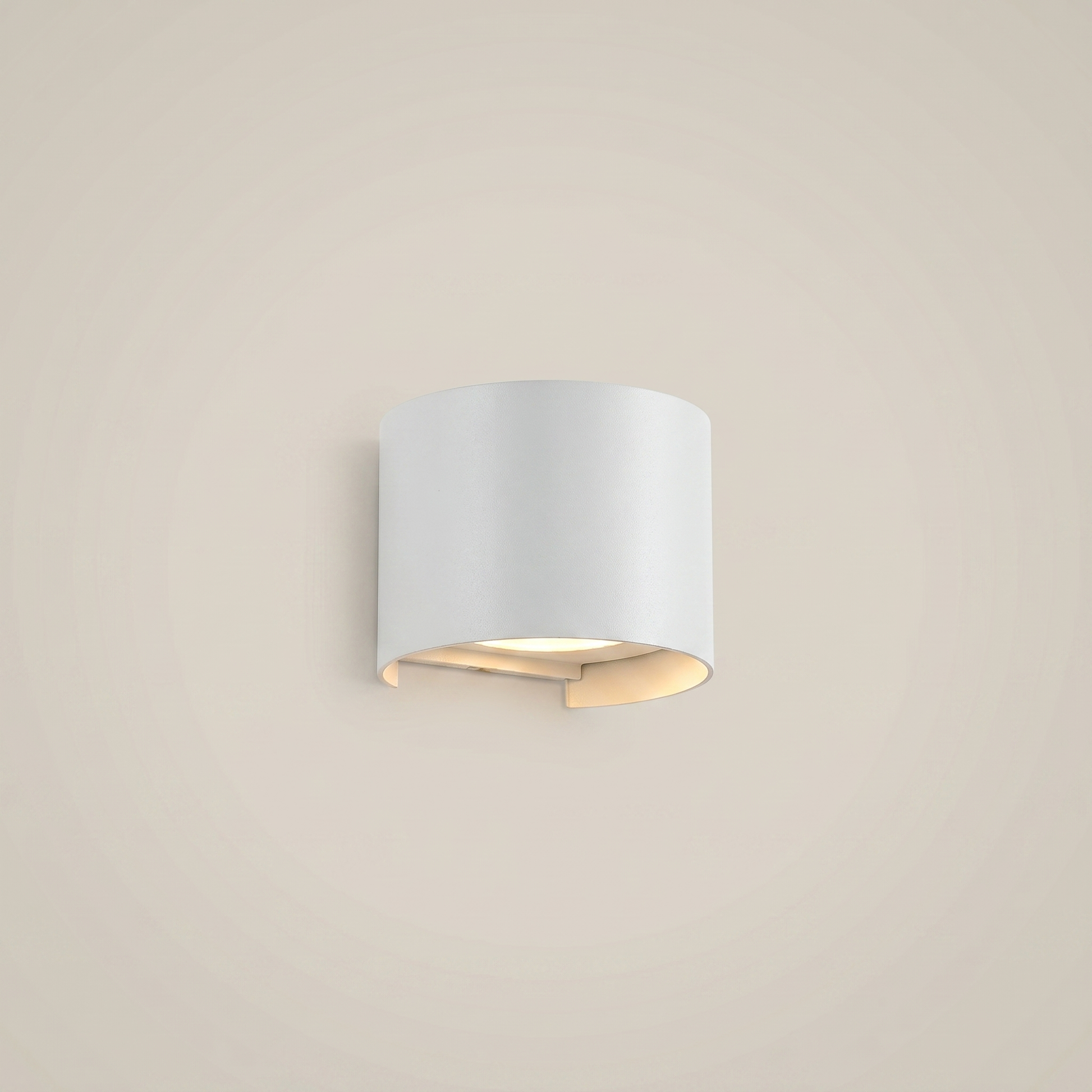 Low angle view of black aluminum square outdoor wall sconce lit on balcony at night with warm white adjustable lighting
